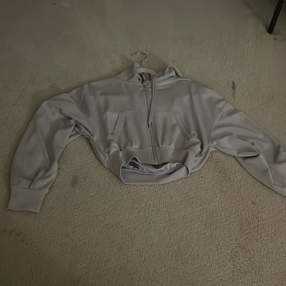 Light grey, small, zip up.